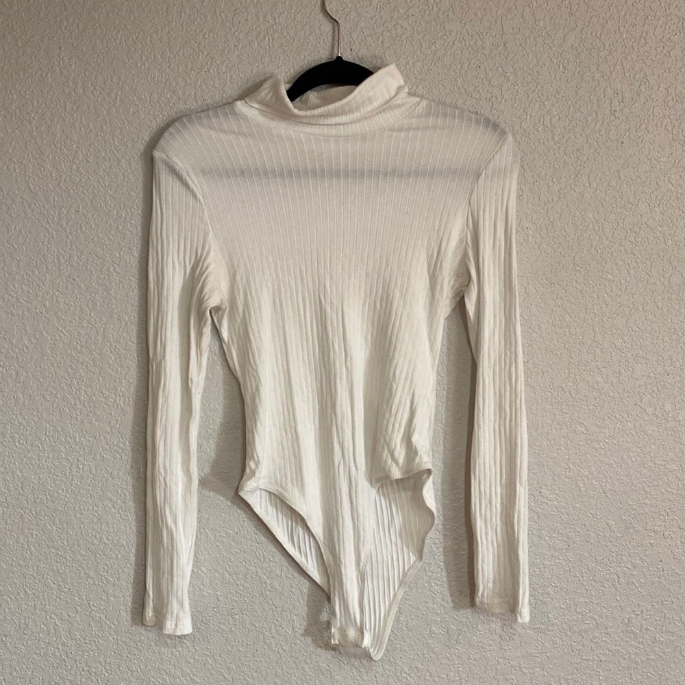 White turtleneck bodysuit.